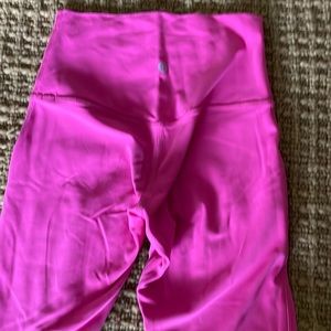 Hot pink Lululemon leggings.